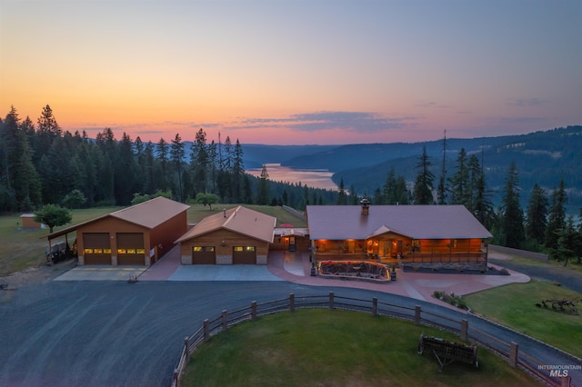 aerial view at dusk of a mountain view and a forest view