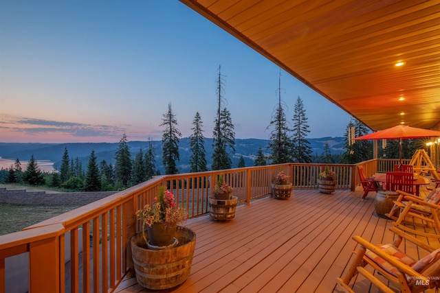 wooden deck featuring a mountain view