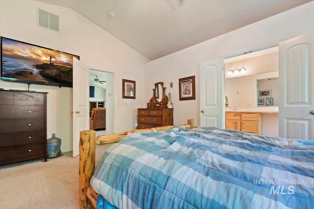 104 Sky Ridge Dr, Garden Valley, ID 83622 - bedroom featuring light colored carpet, vaulted ceiling, and connected bathroom