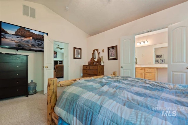 104 Sky Ridge Dr, Garden Valley, ID 83622 - bedroom with light colored carpet, vaulted ceiling, and ensuite bath