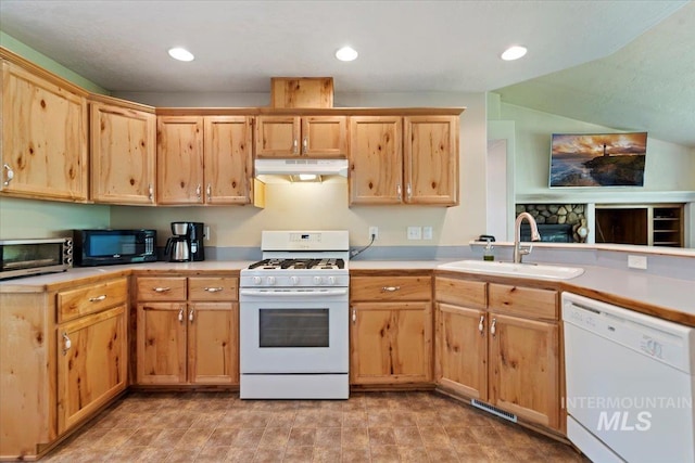 104 Sky Ridge Dr, Garden Valley, ID 83622 - kitchen featuring white appliances, under cabinet range hood, a sink, light brown cabinetry, and light countertops