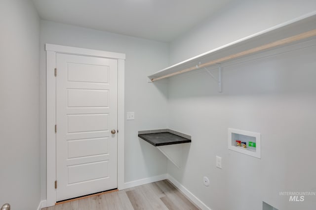 7417 E Shields Dr, Nampa, ID 83687 - laundry room with washer hookup, laundry area, light wood-style flooring, and baseboards