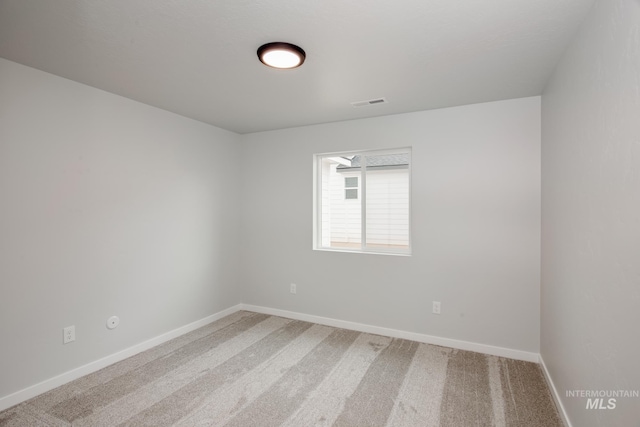 7417 E Shields Dr, Nampa, ID 83687 - spare room featuring visible vents, baseboards, and light colored carpet