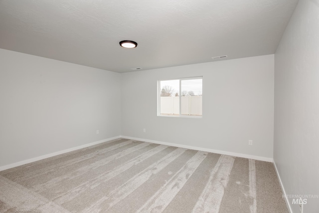 7417 E Shields Dr, Nampa, ID 83687 - carpeted spare room with visible vents, baseboards, and a textured ceiling