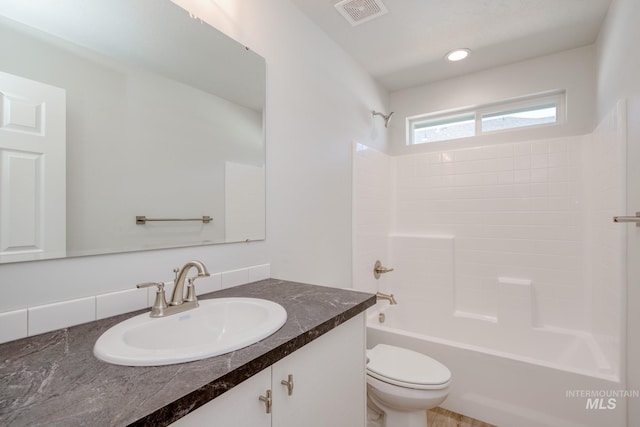 7417 E Shields Dr, Nampa, ID 83687 - full bathroom featuring vanity, visible vents, recessed lighting, toilet, and shower / bathtub combination