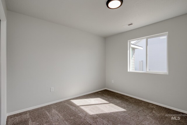 7417 E Shields Dr, Nampa, ID 83687 - unfurnished room with carpet flooring, visible vents, and baseboards