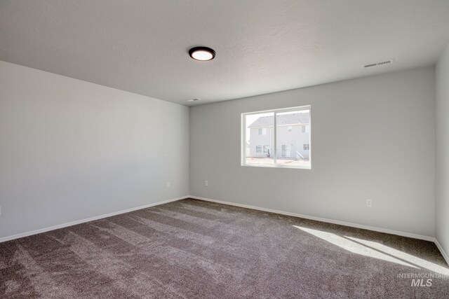 7417 E Shields Dr, Nampa, ID 83687 - carpeted empty room with visible vents, a textured ceiling, and baseboards