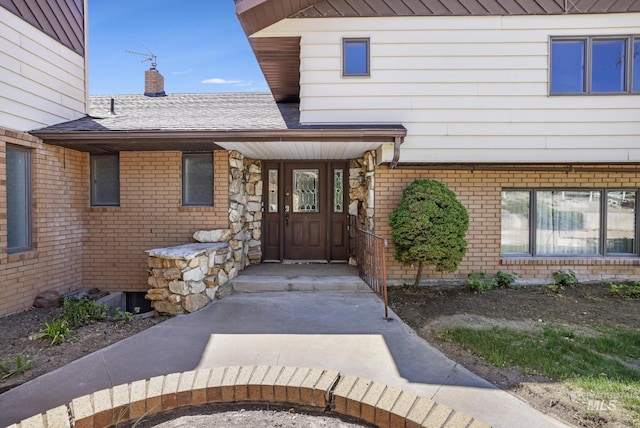 569 Spring Creek Rd, Burley, ID 83318 - entrance to property featuring brick siding, a chimney, and roof with shingles
