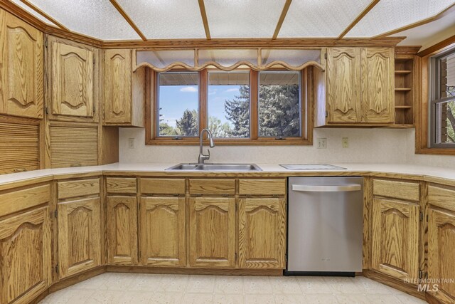 569 Spring Creek Rd, Burley, ID 83318 - kitchen featuring dishwasher, a sink, light countertops, brown cabinetry, and open shelves