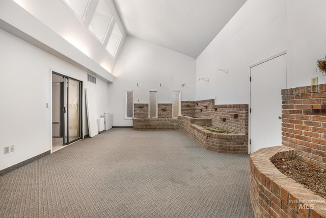 569 Spring Creek Rd, Burley, ID 83318 - building lobby featuring high vaulted ceiling and brick wall