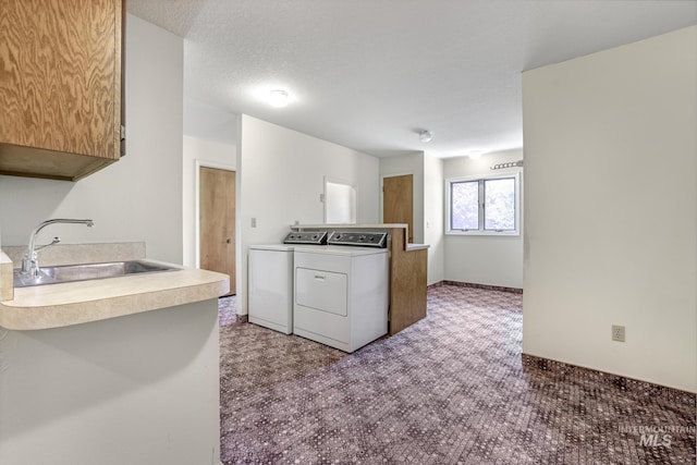 569 Spring Creek Rd, Burley, ID 83318 - kitchen featuring independent washer and dryer, a sink, and carpet