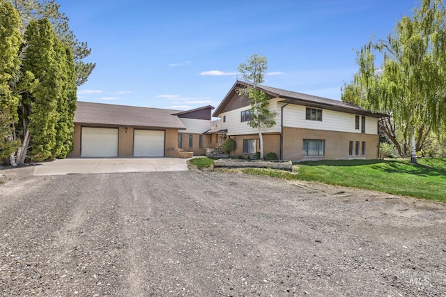 569 Spring Creek Rd, Burley, ID 83318 - multi unit property with dirt driveway, brick siding, an outbuilding, a garage, and a front yard