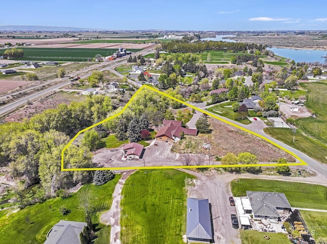 569 Spring Creek Rd, Burley, ID 83318 - aerial perspective of suburban area featuring property parcel outlined and a nearby body of water