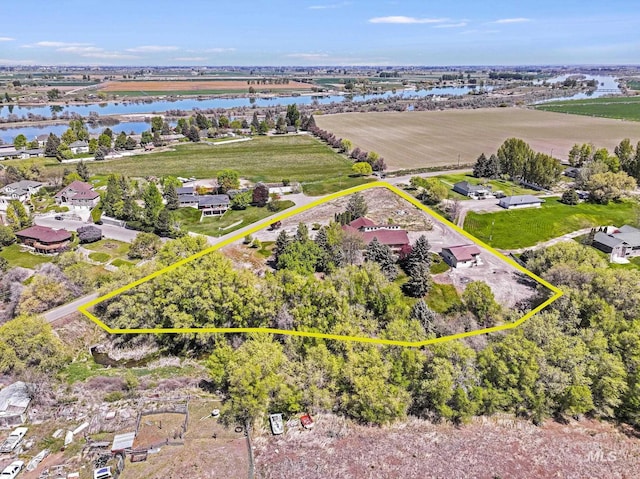 569 Spring Creek Rd, Burley, ID 83318 - aerial view of property and surrounding area featuring property boundaries highlighted, a large body of water, and a tree filled landscape