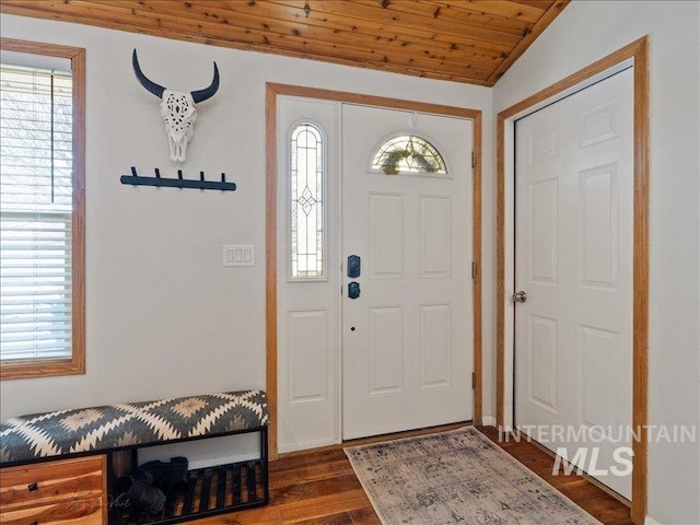 entryway featuring vaulted ceiling, dark wood-type flooring, and wood ceiling