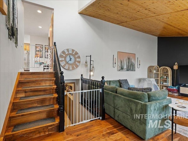 living room featuring hardwood / wood-style floors and wood ceiling