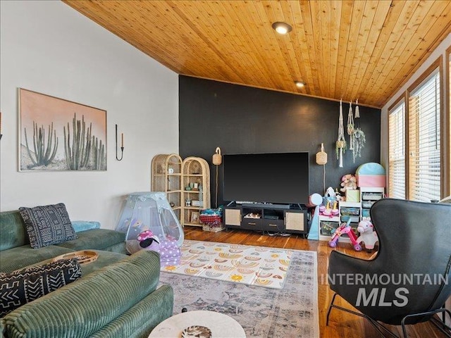 living room featuring hardwood / wood-style flooring, vaulted ceiling, and wooden ceiling