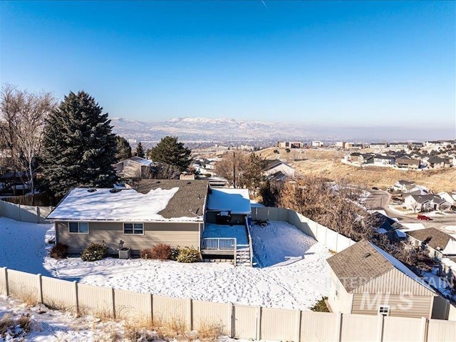 snowy aerial view featuring a mountain view