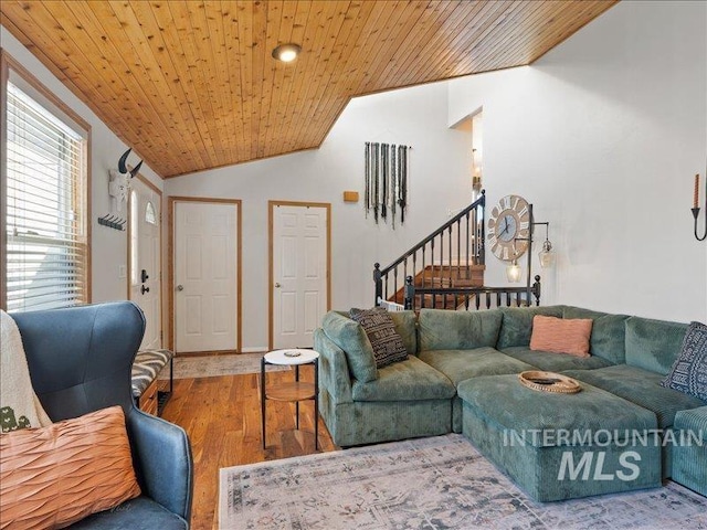 living room featuring wood-type flooring, vaulted ceiling, and wooden ceiling