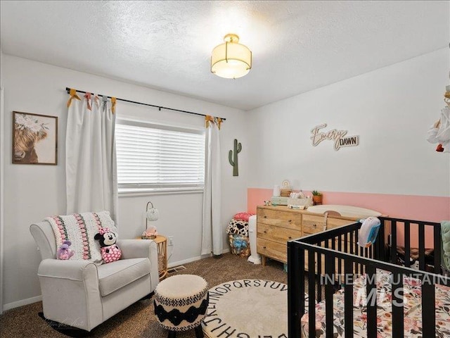 carpeted bedroom with a textured ceiling