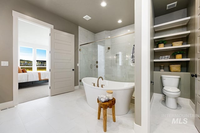 bathroom featuring a stall shower, baseboards, visible vents, toilet, and a freestanding bath