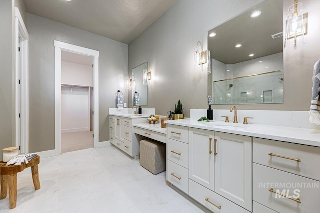 full bath with recessed lighting, two vanities, a sink, marble finish floor, and a shower stall