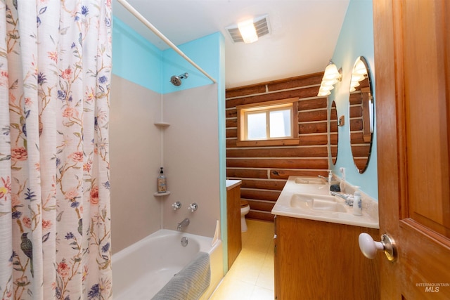130 Valley Creek Rd, Stanley, ID 83278 - bathroom with log walls, toilet, shower / bathtub combination with curtain, and vanity