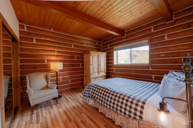 130 Valley Creek Rd, Stanley, ID 83278 - bedroom featuring wood ceiling with exposed beams, light wood-type flooring, and log walls