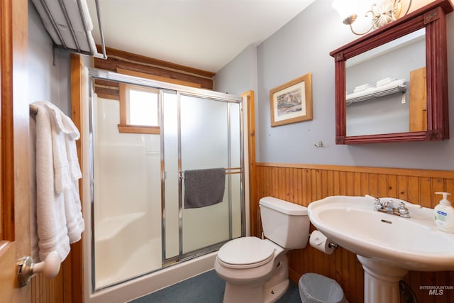 130 Valley Creek Rd, Stanley, ID 83278 - full bath with wainscoting, a stall shower, toilet, wood walls, and a sink