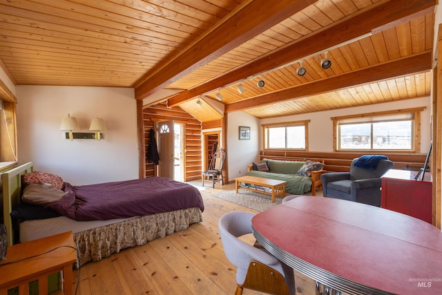 130 Valley Creek Rd, Stanley, ID 83278 - bedroom with hardwood / wood-style floors, wooden ceiling, and rustic walls