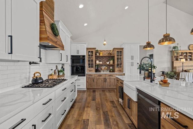 kitchen with dobule oven black, dishwashing machine, custom range hood, gas stovetop, and a sink