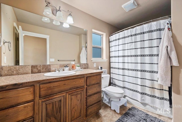 full bath with vanity, curtained shower, and toilet