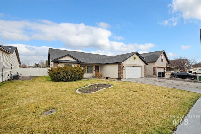 view of front of property with a front lawn, fence, concrete driveway, cooling unit, and a garage