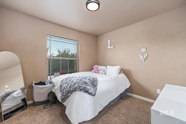 carpeted bedroom with baseboards