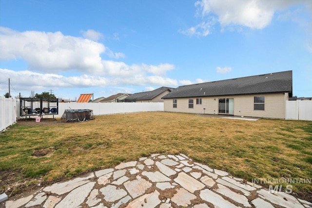 view of yard with a patio area and a fenced backyard