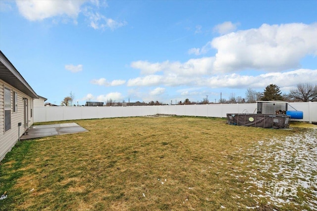 view of yard featuring a patio area and a fenced backyard