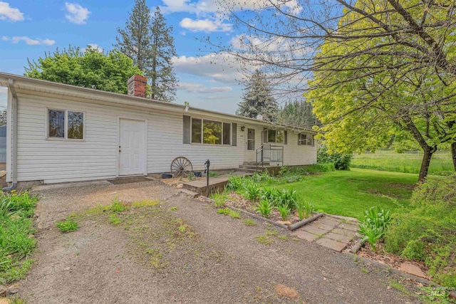 478AND716 Three Bear Rd, Kendrick, ID 83537 - ranch-style house featuring a chimney and a front lawn