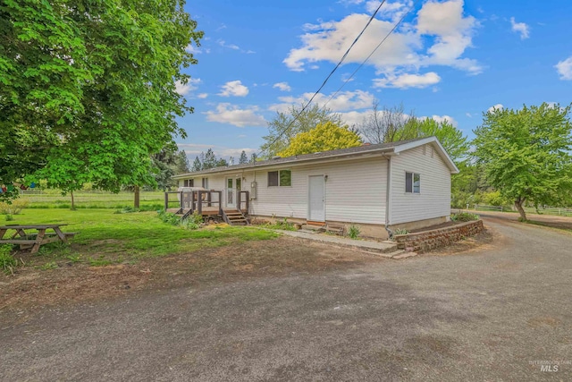 478AND716 Three Bear Rd, Kendrick, ID 83537 - view of home's exterior featuring a wooden deck and a lawn