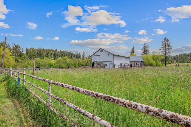 478AND716 Three Bear Rd, Kendrick, ID 83537 - view of yard with a wooded view, an outdoor structure, and a view of rural / pastoral area