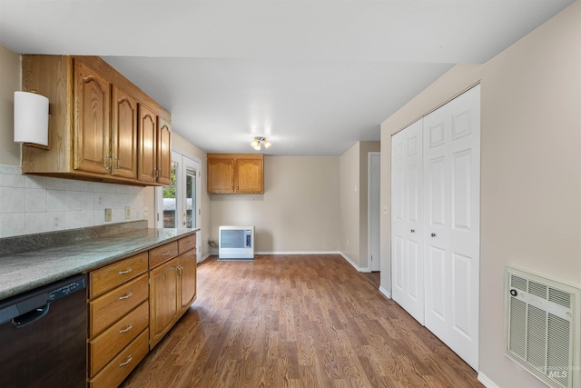 478AND716 Three Bear Rd, Kendrick, ID 83537 - kitchen with black dishwasher, dark wood-style floors, backsplash, and brown cabinetry