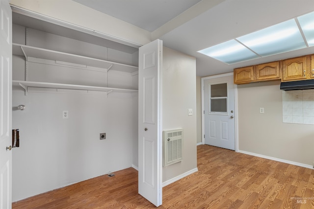478AND716 Three Bear Rd, Kendrick, ID 83537 - washroom featuring hookup for an electric dryer, light wood-type flooring, and heating unit
