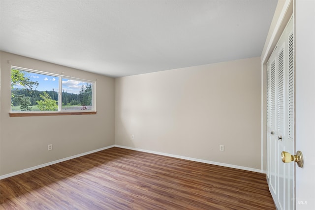 478AND716 Three Bear Rd, Kendrick, ID 83537 - unfurnished bedroom featuring wood finished floors, baseboards, and a closet