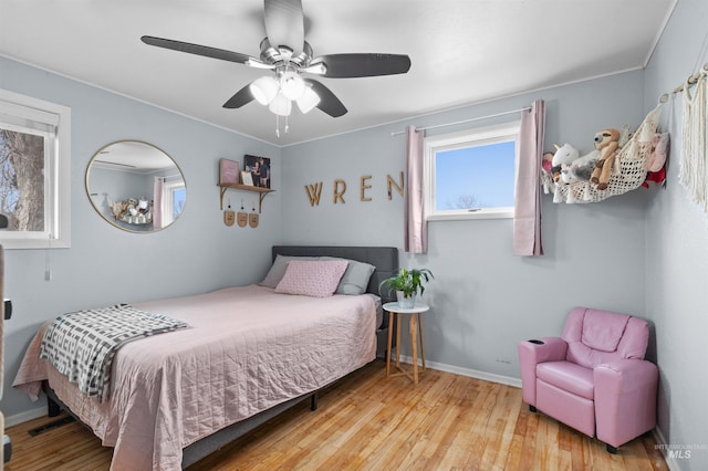 bedroom featuring ceiling fan and light hardwood / wood-style flooring