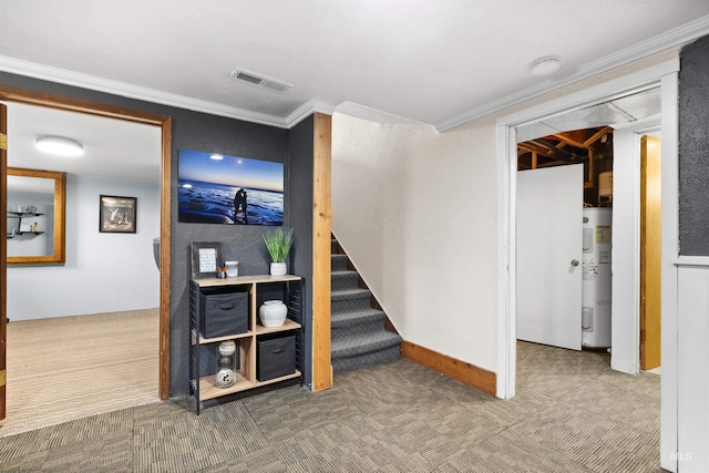 basement with carpet floors, ornamental molding, and water heater