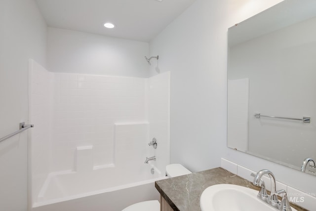 bathroom featuring toilet, recessed lighting, shower / washtub combination, and vanity