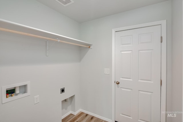 laundry room featuring laundry area, washer hookup, visible vents, light wood finished floors, and electric dryer hookup