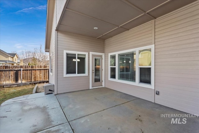 view of patio / terrace featuring fence