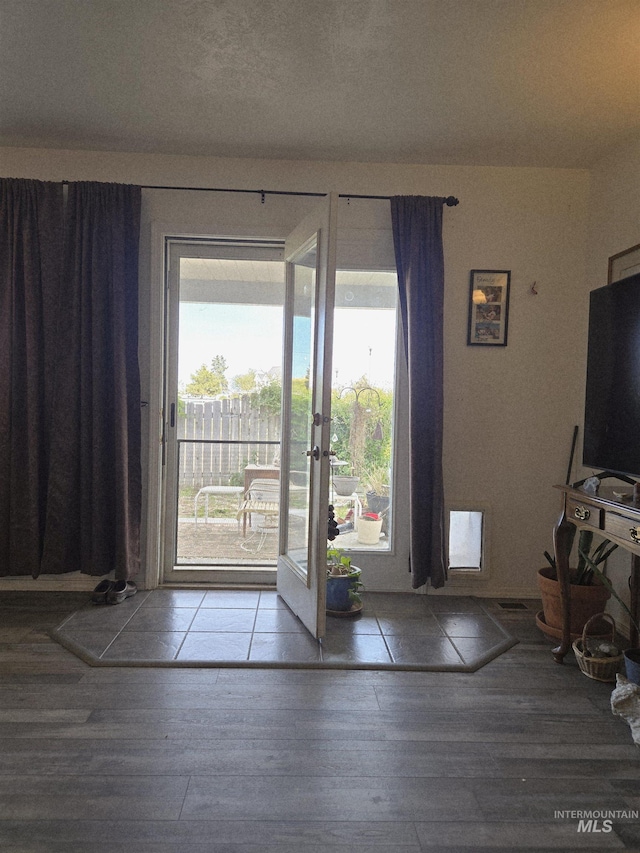 doorway to outside with french doors and wood finished floors