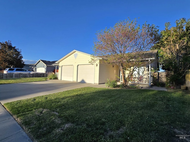 single story home with driveway, a front lawn, a garage, and fence