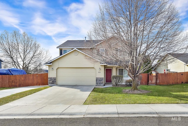 traditional-style home featuring stone siding, driveway, and fence